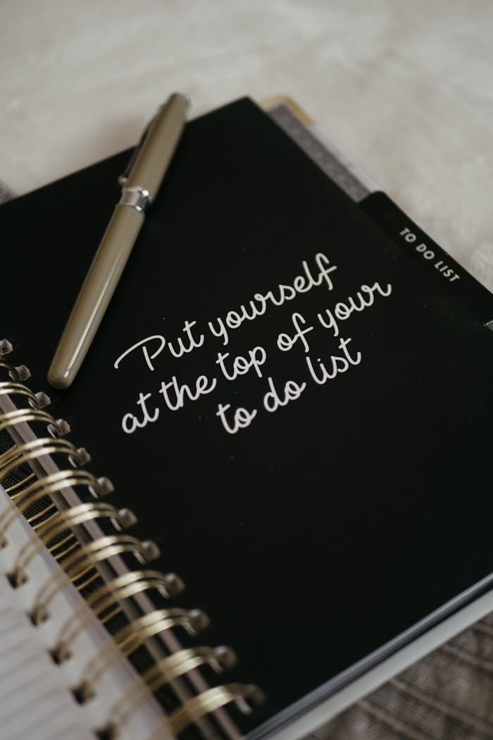 Crafting Captivating Headlines: Your awesome post title goes here Close-up of a notebook with an inspirational message to prioritize yourself.